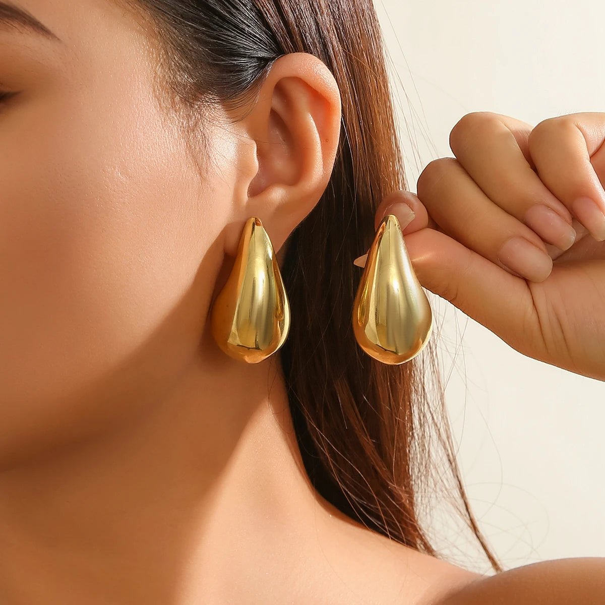 Statement Water Drop Earrings in Gold and Silver – Minimalist Stud Design